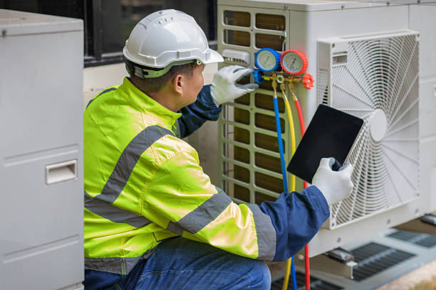 Professional Air Conditioning Repair technician working in Gold Hill, OR